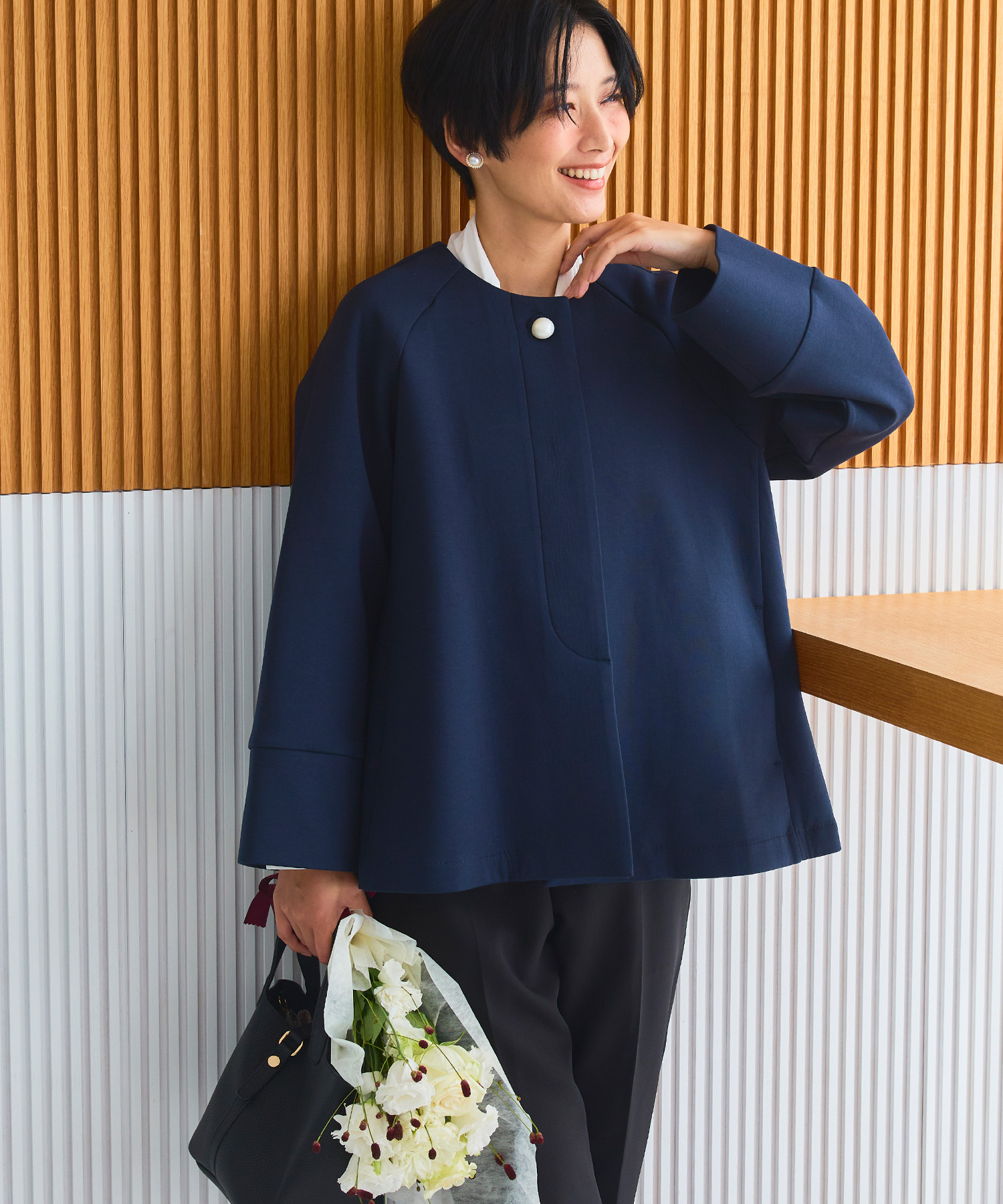 正解 パールボタンAラインコート ¥9,900(tax in) NAVY